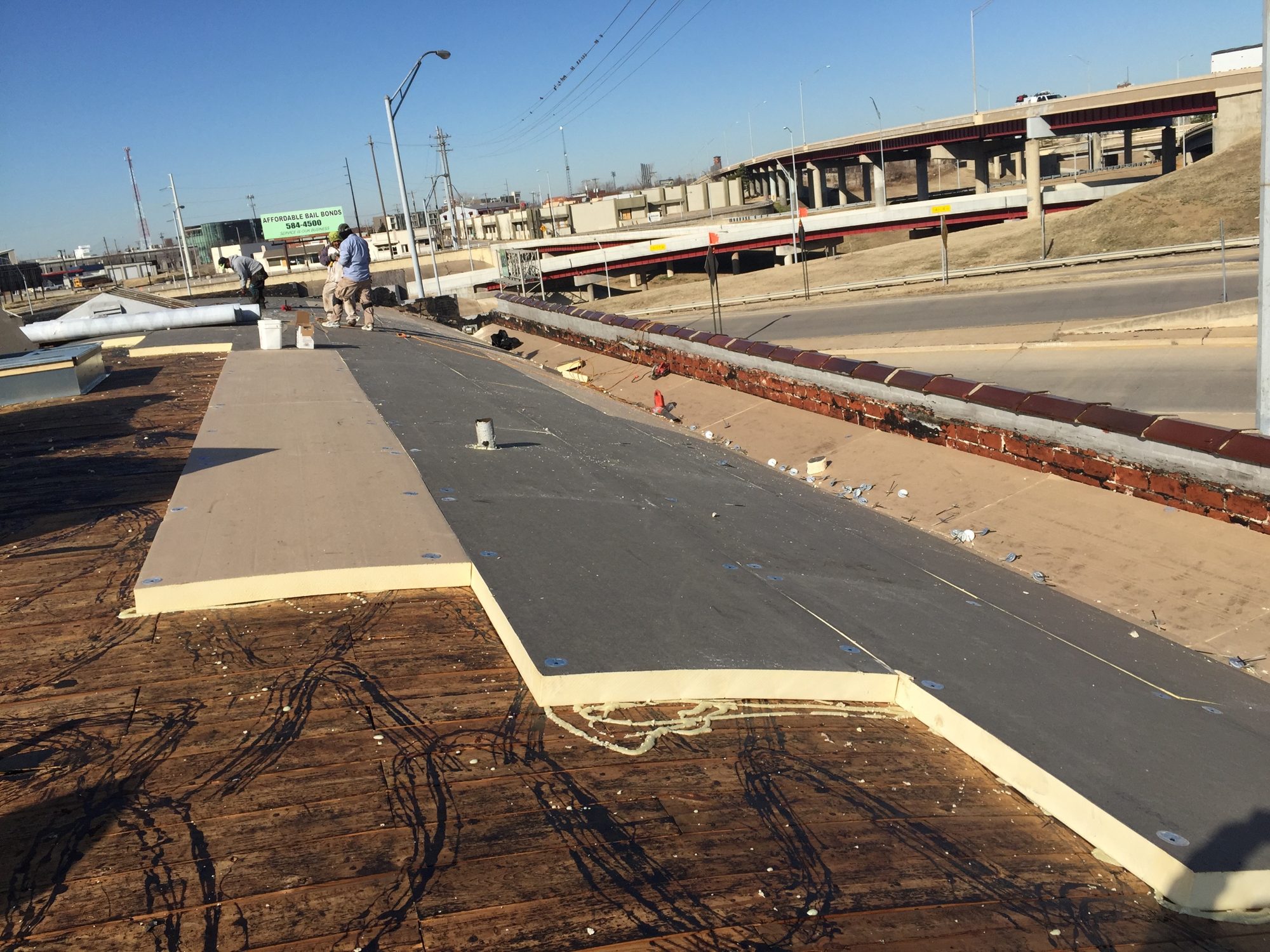 Roofspan crew installing a new roof on the Hawley building in Tulsa