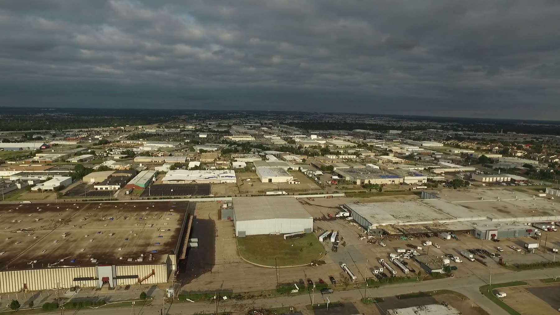 Storm clouds over a Tulsa industrial district