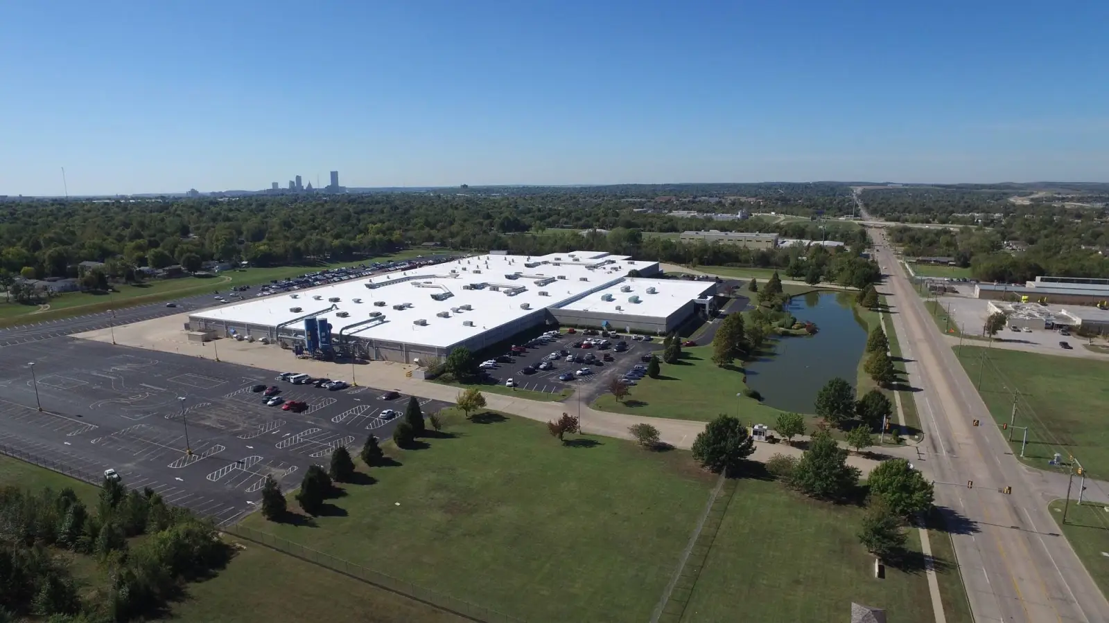ResourceOne Apache Street roof with the Tulsa skyline